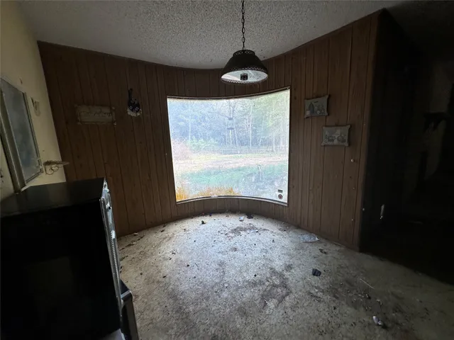 a bathroom with a granite countertop sink a washer and dryer