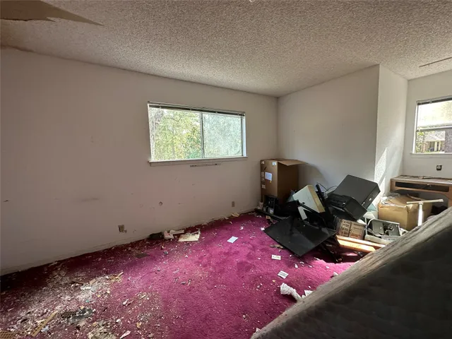 a front view of a house with trees