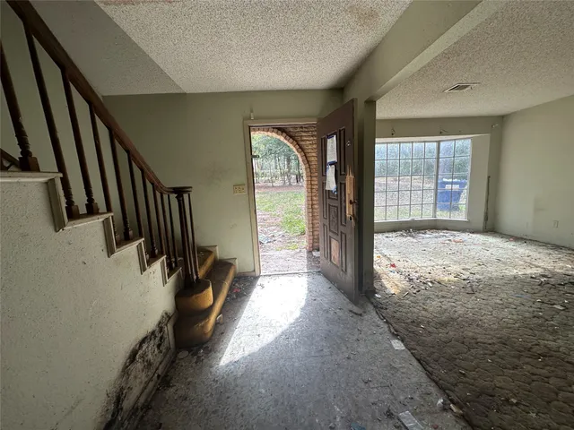 a view of outdoor space with a garden and trees