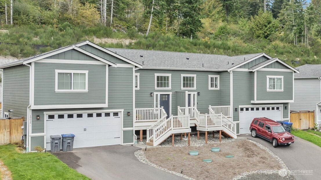 a view of a house with a patio and backyard