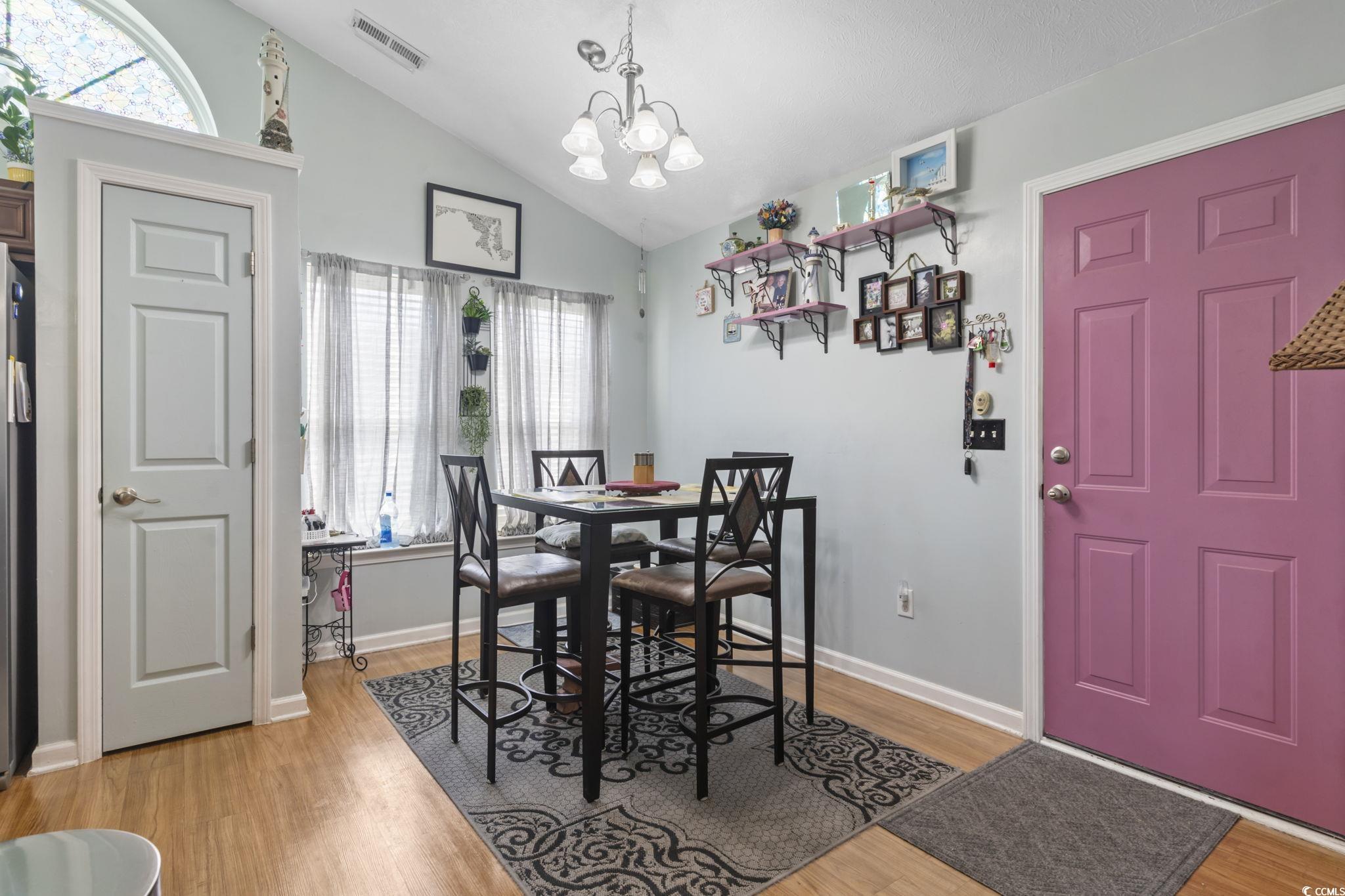 105 Windsor Springs Road Conway, SC 29527 - Photo 13 of 35 Dining room with a chandelier, light wood-style fl