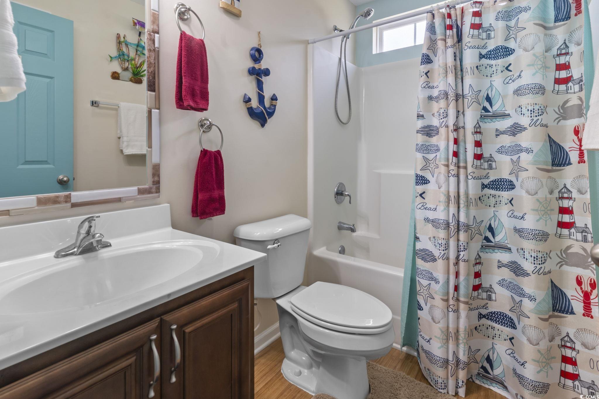 105 Windsor Springs Road Conway, SC 29527 - Photo 15 of 35 Bathroom with toilet, shower / tub combo, wood fin