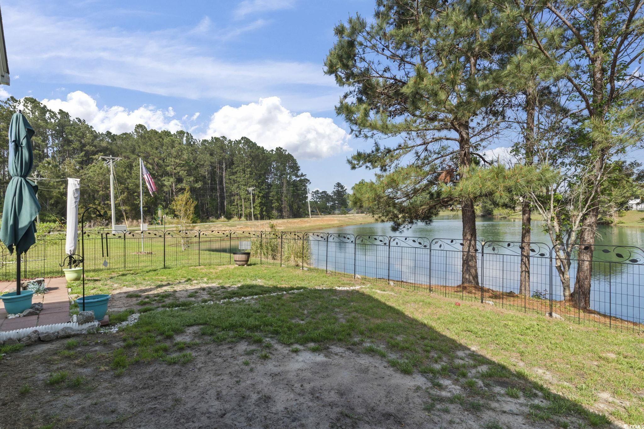 105 Windsor Springs Road Conway, SC 29527 - Photo 24 of 35 View of yard featuring fence and a water view