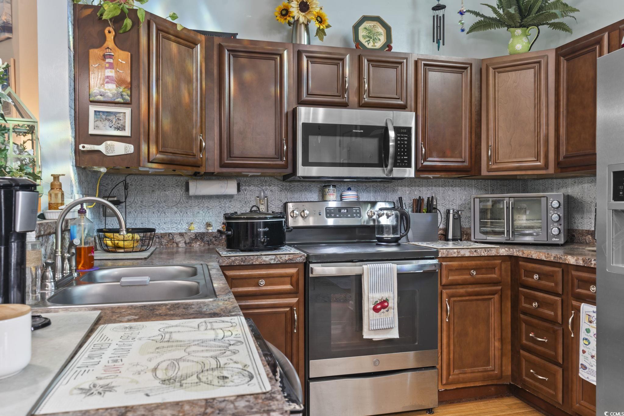 105 Windsor Springs Road Conway, SC 29527 - Photo 10 of 35 Kitchen featuring tasteful backsplash, a sink, app