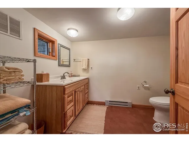 a bathroom with a sink a mirror and a shower