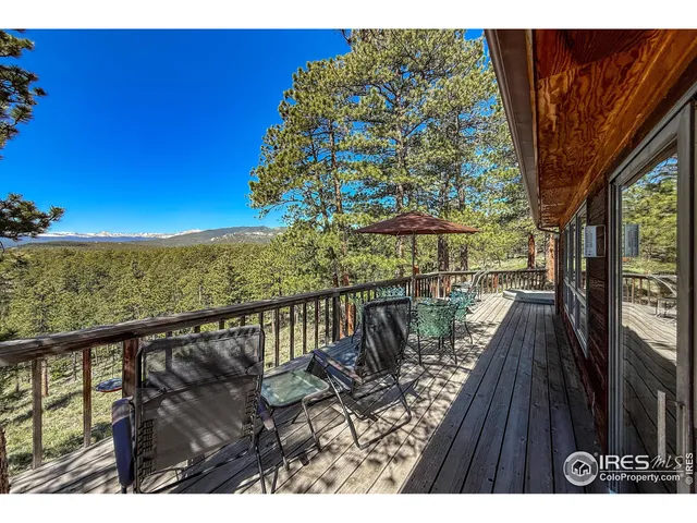 a view of balcony with wooden floor and lake view