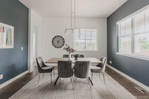 a view of a dining room with furniture window and wooden floor