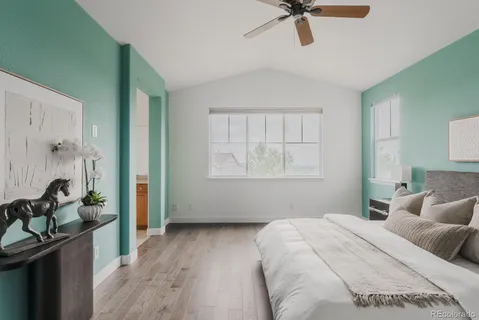 a bedroom with a bed dresser and a window