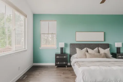 a bedroom with a bed and window