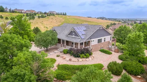 an aerial view of a house with a garden