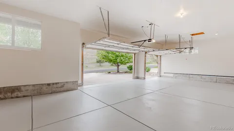 a kitchen with stainless steel appliances granite countertop a sink and a stove