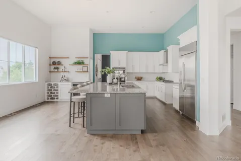 a kitchen with a sink cabinets and window