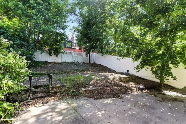 a backyard of a house with lots of green space