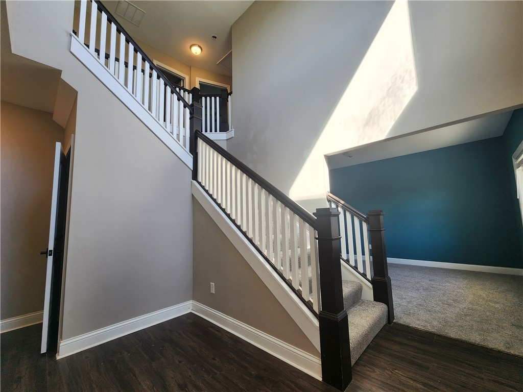 7441 Dodson Road Brookville, OH 45309 - Photo 42 of 50 This inviting interior features a grand staircase and a spacious area, perfect for modern living.