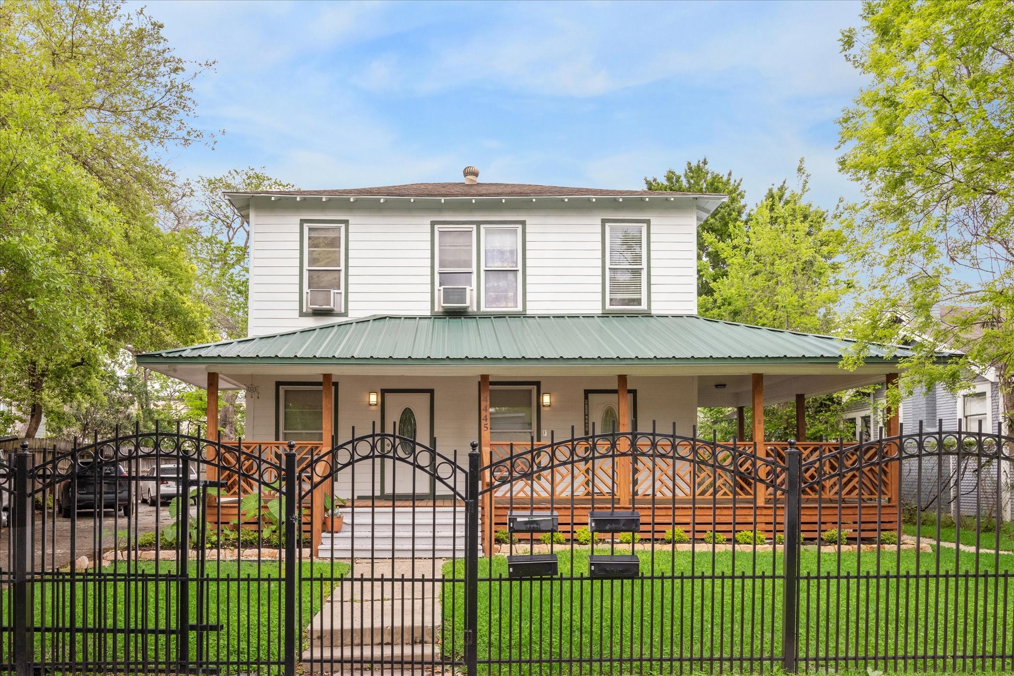 Fully fenced all around and mature oak trees decorate the curb appeal.