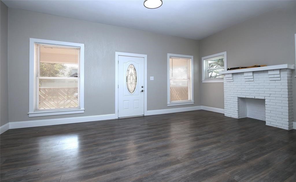 4445 Rusk Street Houston, TX 77023 - Photo 12 of 50 Unit #1 living room with fresh paint, new light fixtures, and new floors.