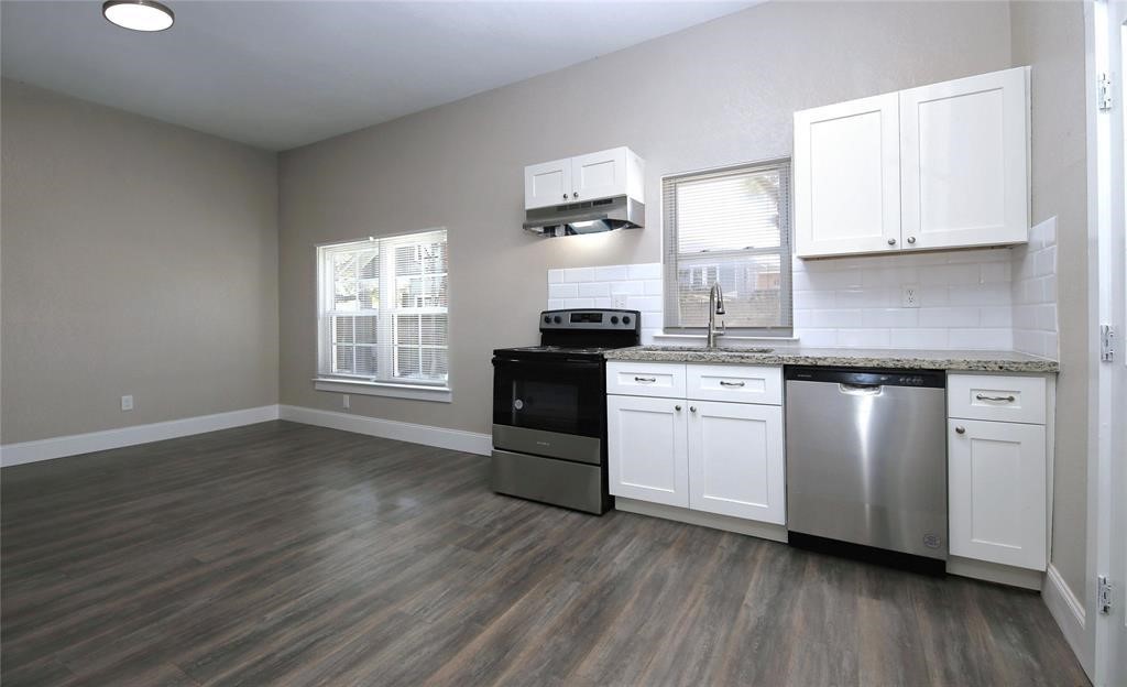 4445 Rusk Street Houston, TX 77023 - Photo 17 of 50 New granite counters, custom cabinetry, stainless steel appliances.