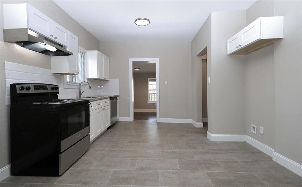 4445 Rusk Street Houston, TX 77023 - Photo 30 of 50 Unit #3 offers contemporary finishes with high ceilings, custom cabinets, SS appliances, and subway tile backsplash.