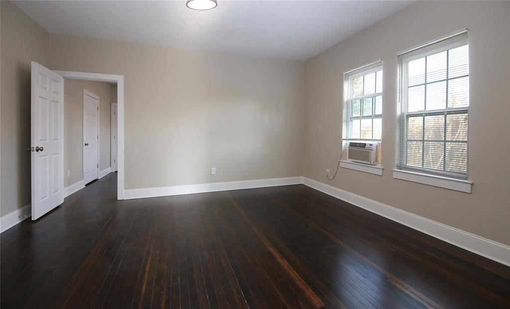 4445 Rusk Street Houston, TX 77023 - Photo 38 of 50 Unit #4 living area offers refinished original hardwood floors, and an abundance of natural light.