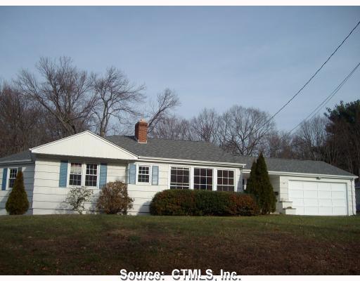 64 Killingly Drive Killingly, CT 06239 - Photo 1 of 1 a front view of a house with a garden