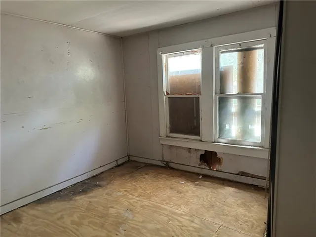 a view of a room with rack and a window