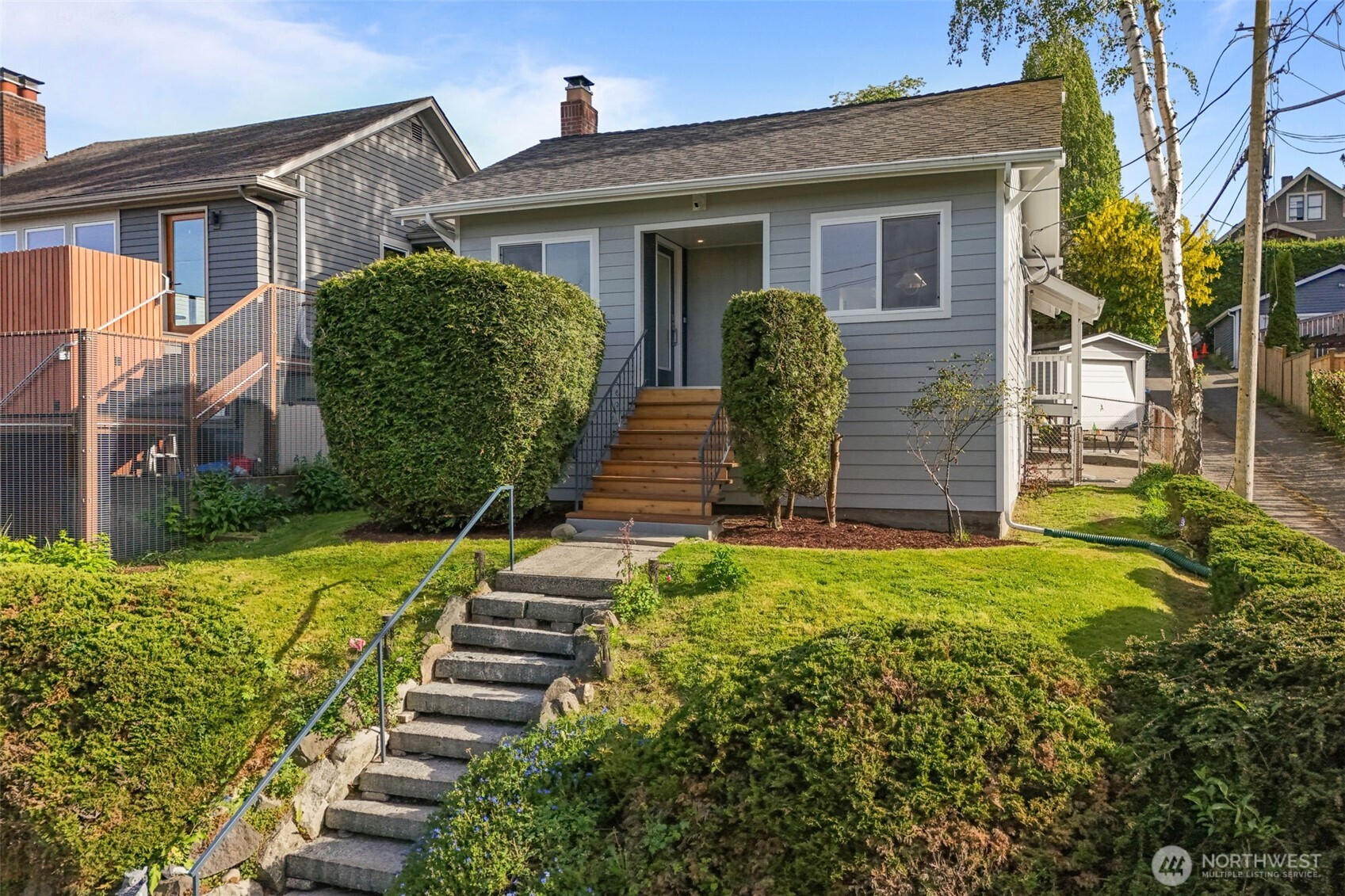 a front view of a house with garden