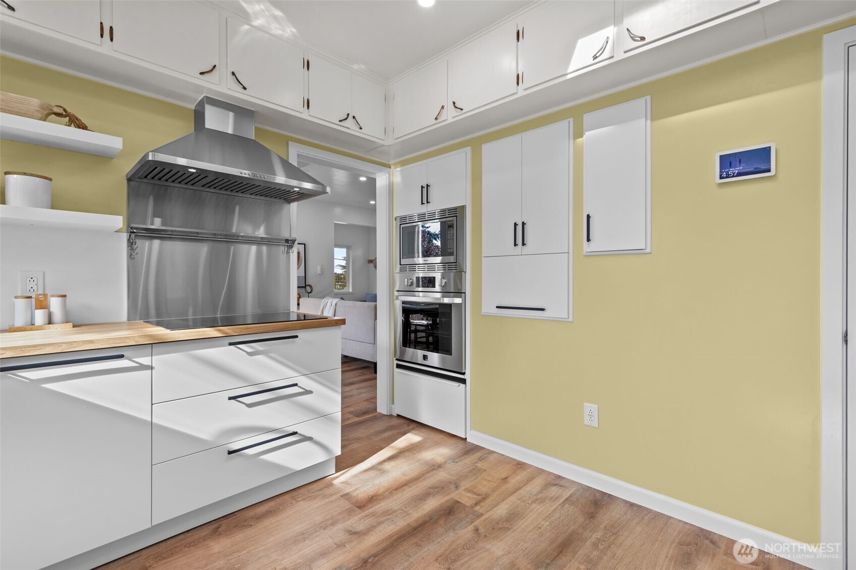 11 West Fulton Street Seattle, WA 98119 - Photo 13 of 40 a kitchen with stainless steel appliances a refrigerator and a stove
