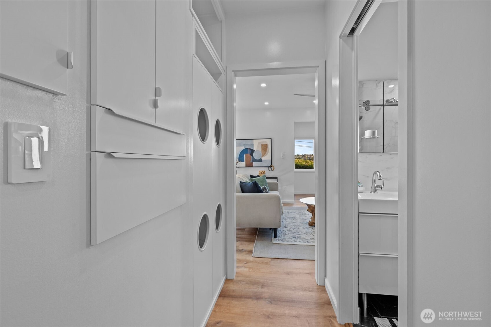 11 West Fulton Street Seattle, WA 98119 - Photo 14 of 40 a hallway with white cabinets and wooden floor