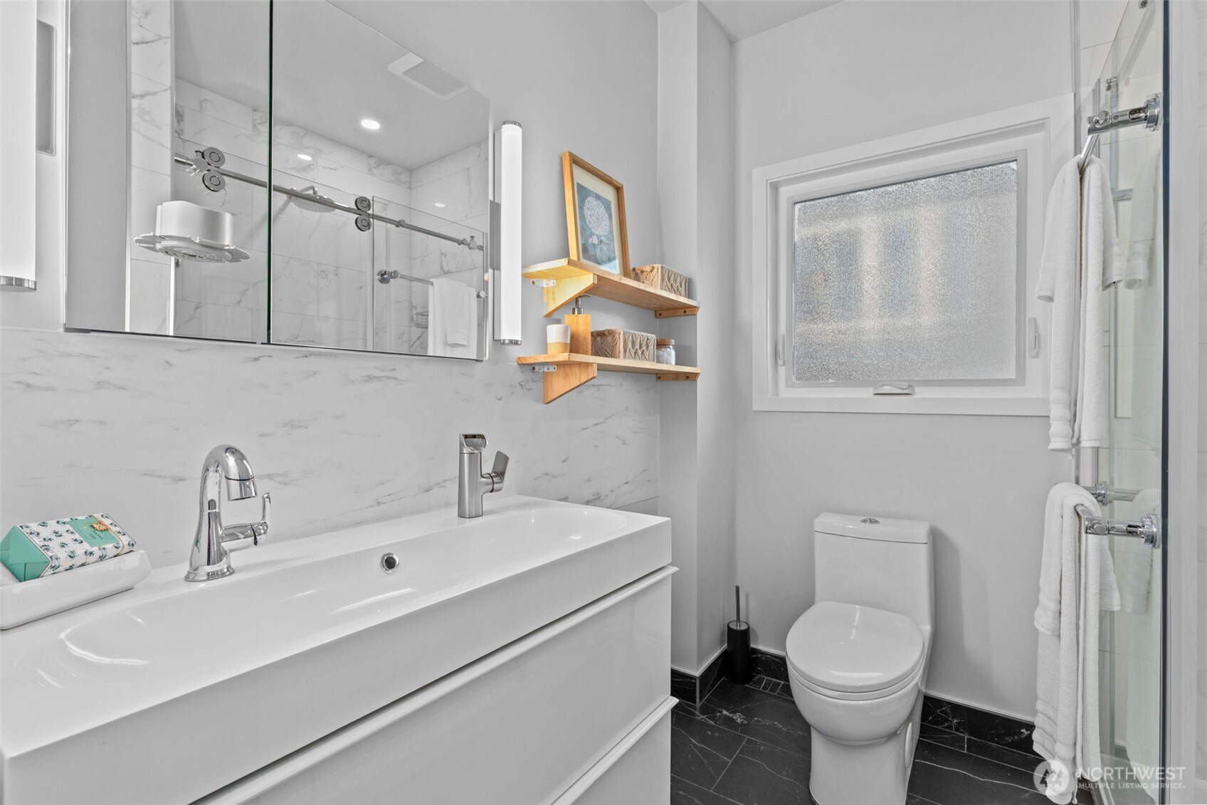 11 West Fulton Street Seattle, WA 98119 - Photo 15 of 40 a bathroom with a sink mirror toilet and vanity