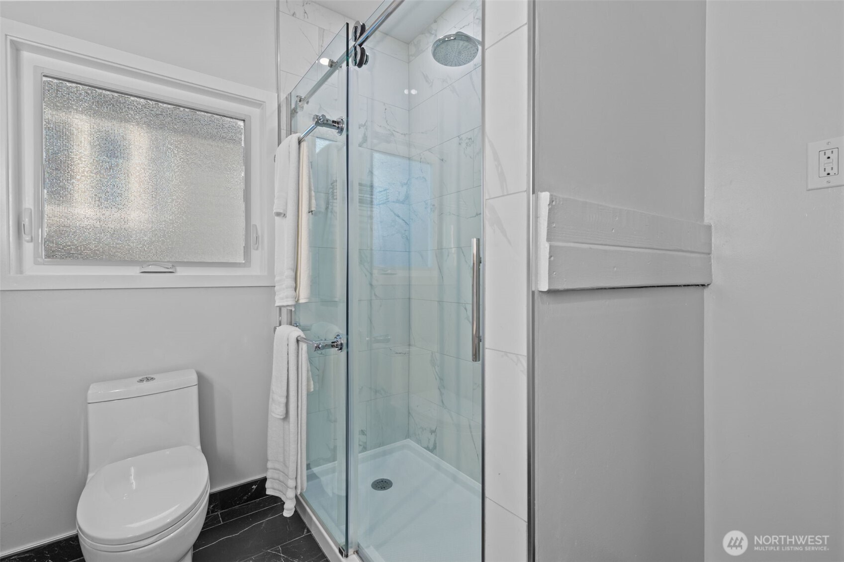 11 West Fulton Street Seattle, WA 98119 - Photo 16 of 40 a bathroom with a shower a toilet and a sink