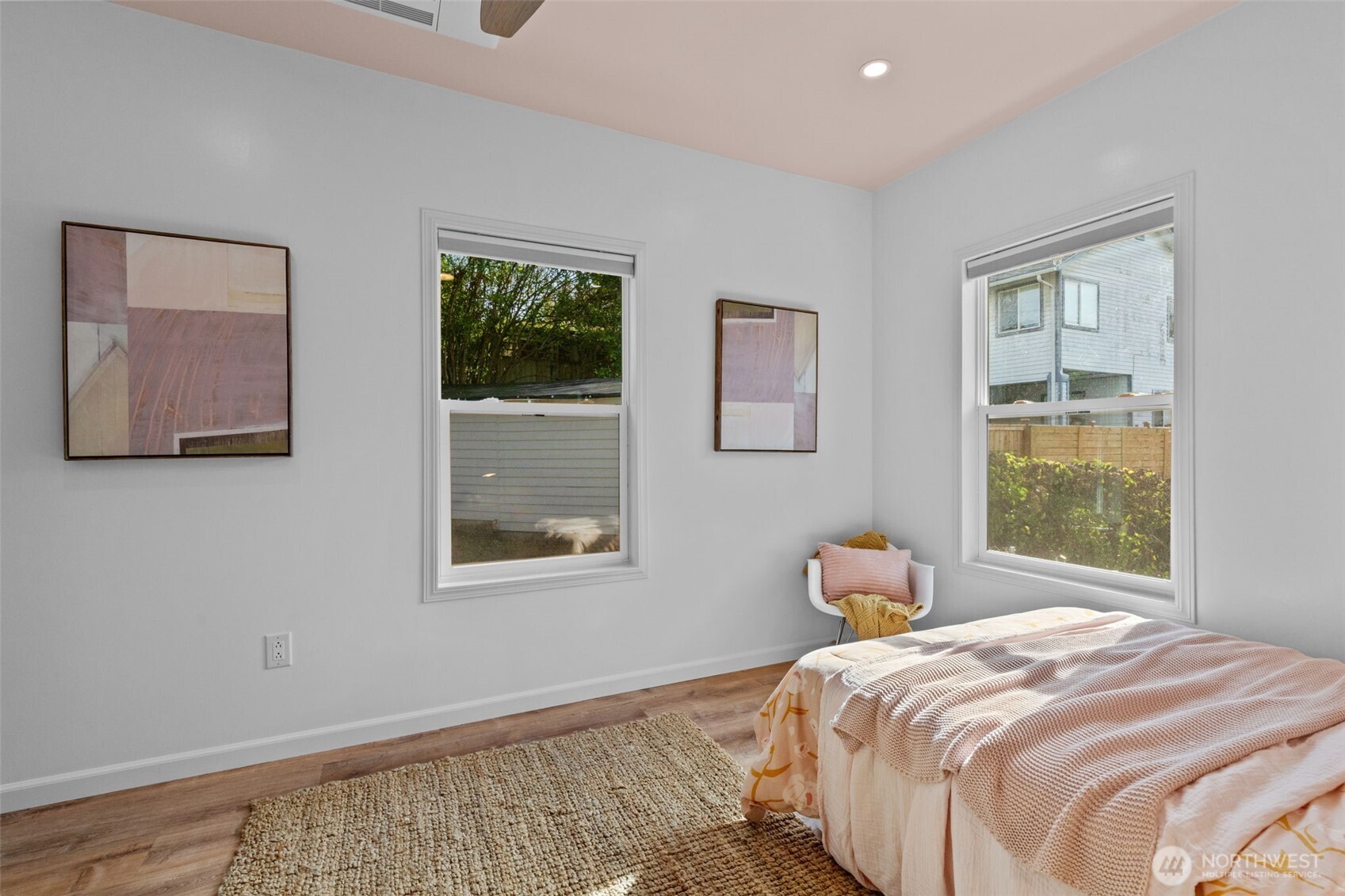 11 West Fulton Street Seattle, WA 98119 - Photo 22 of 40 a bedroom with a bed and wooden floor