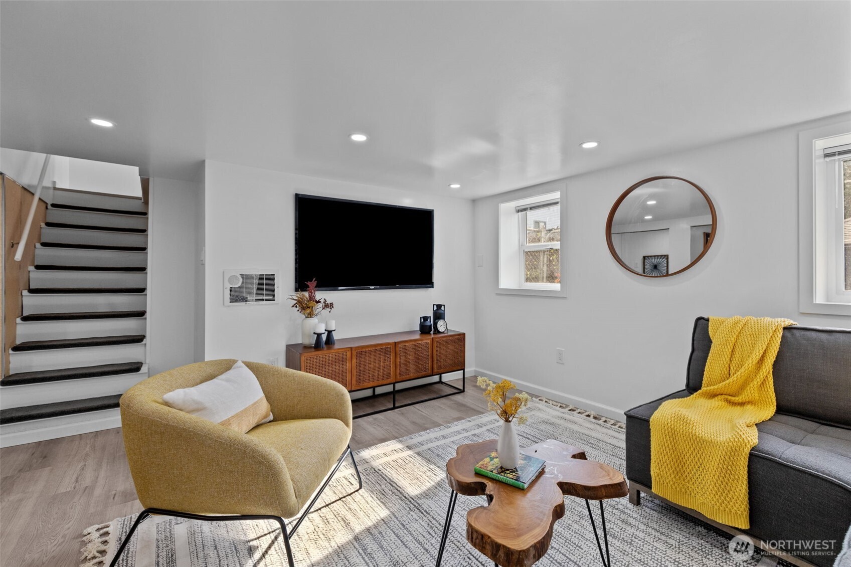 11 West Fulton Street Seattle, WA 98119 - Photo 25 of 40 a living room with furniture and a flat screen tv