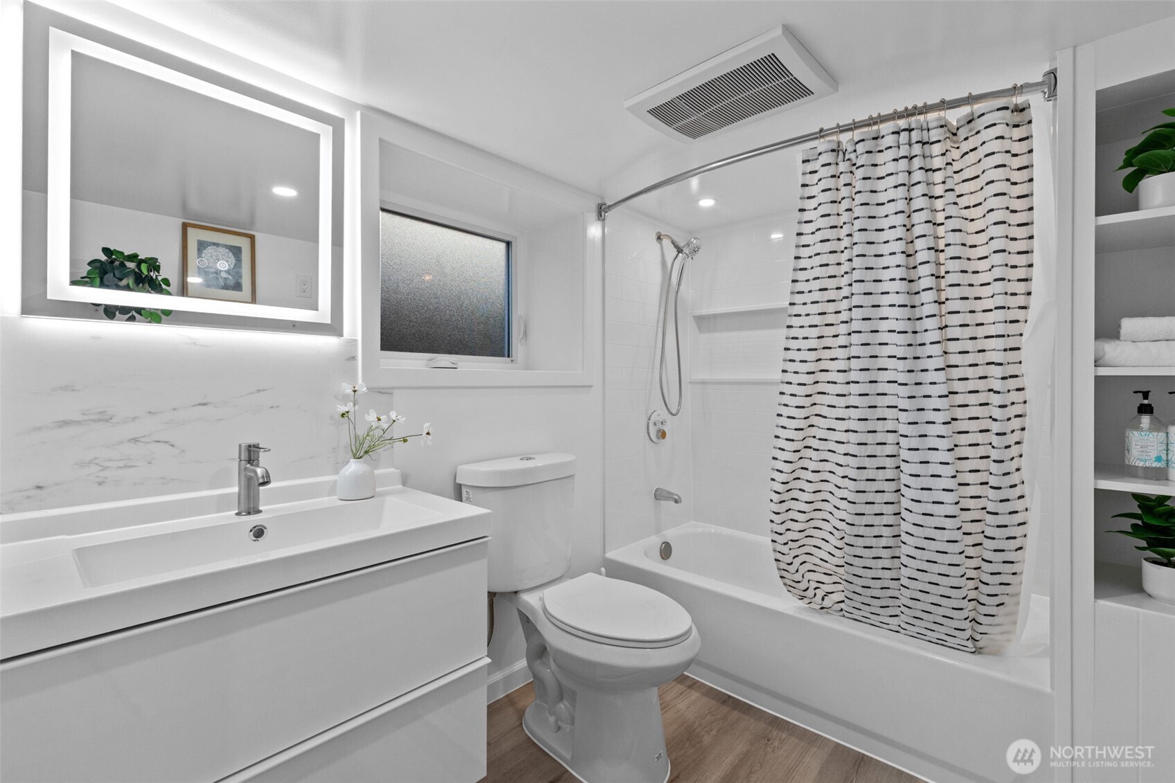 11 West Fulton Street Seattle, WA 98119 - Photo 27 of 40 a bathroom with a sink a toilet and shower