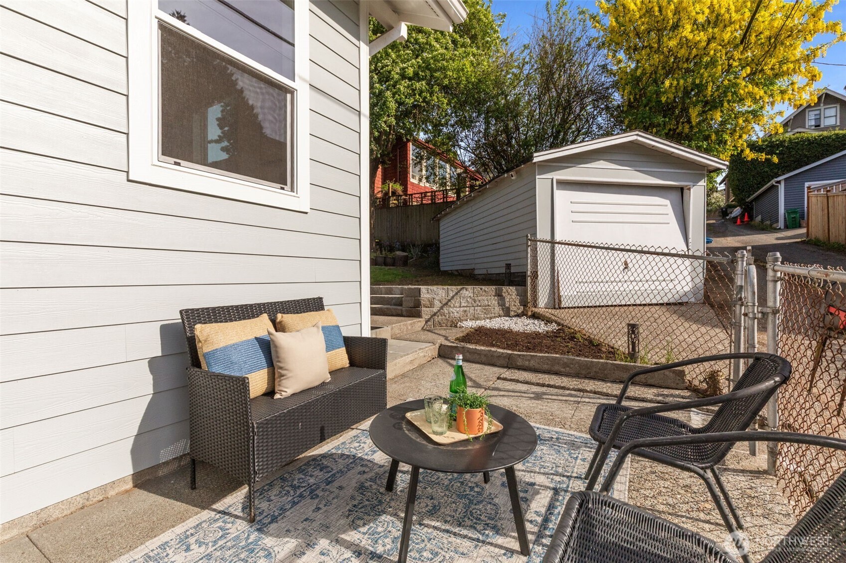 11 West Fulton Street Seattle, WA 98119 - Photo 31 of 40 a backyard of a house with fire pit and couch