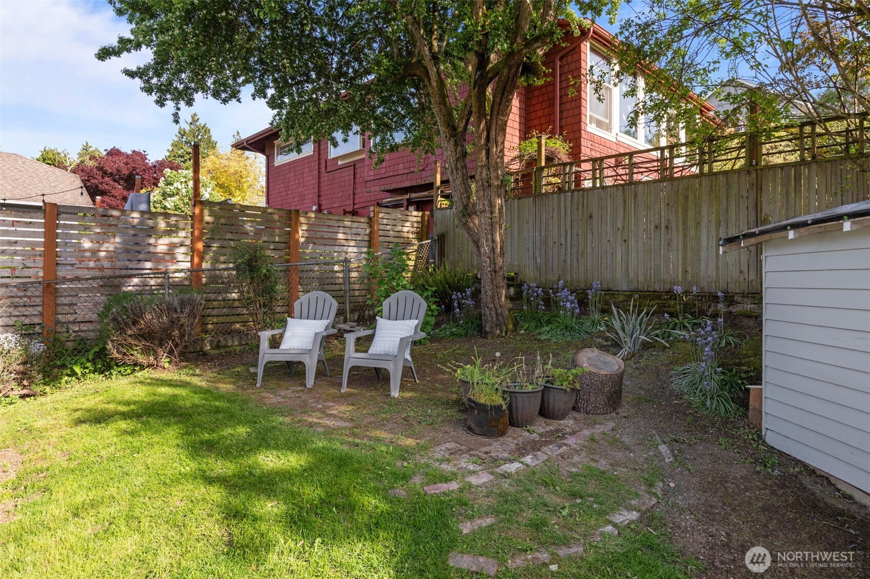 11 West Fulton Street Seattle, WA 98119 - Photo 33 of 40 a view of a chair and table in backyard of the house