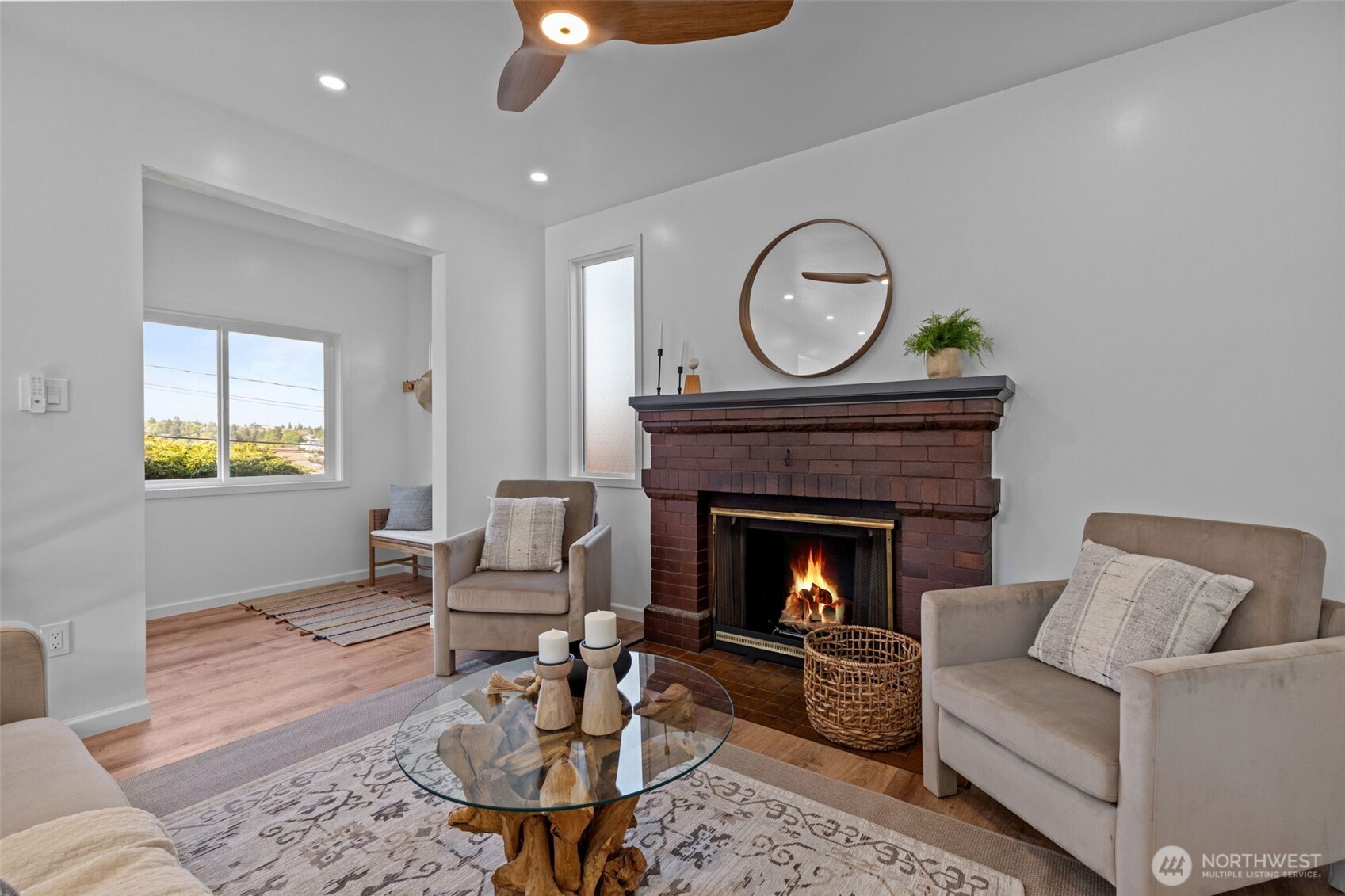 11 West Fulton Street Seattle, WA 98119 - Photo 4 of 40 a living room with furniture a clock and a fireplace