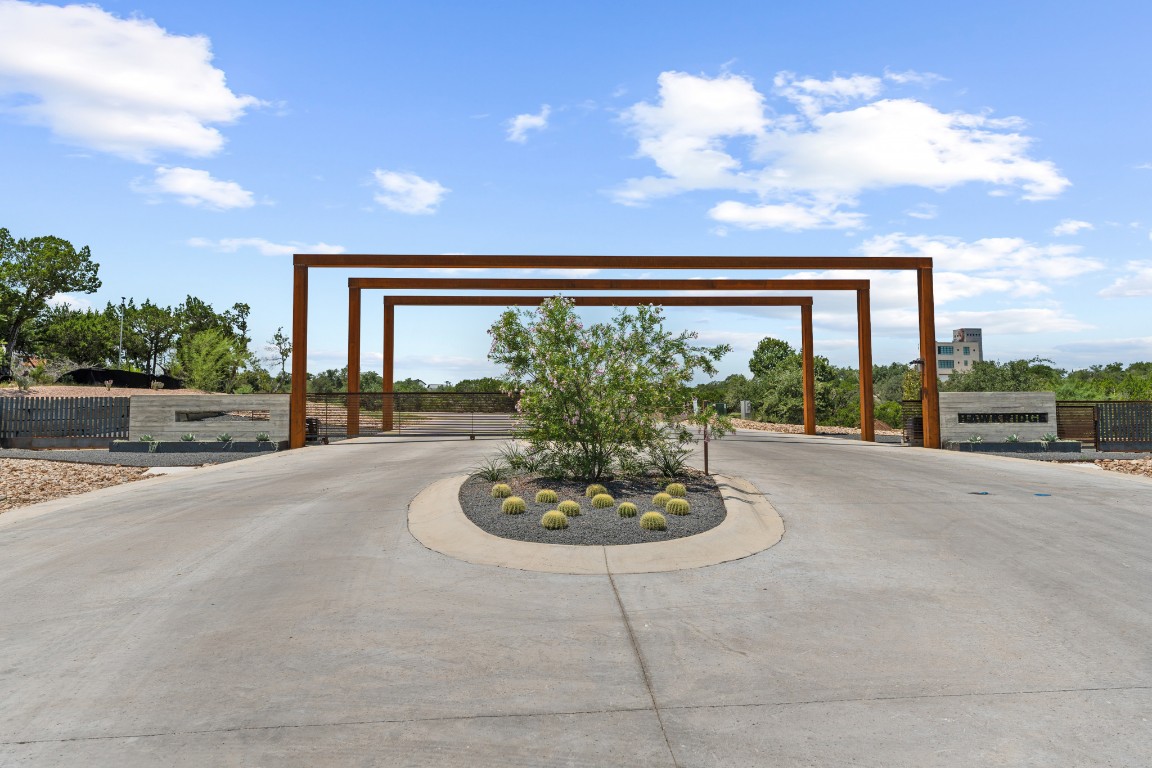 7 B Broadwing Cove Austin, TX 78737 - Photo 14 of 14 a view of a house with a yard and a garden
