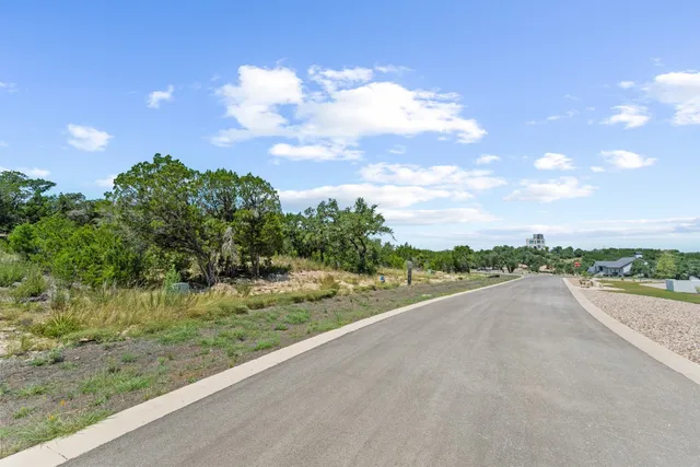 a view of a road with an ocean view