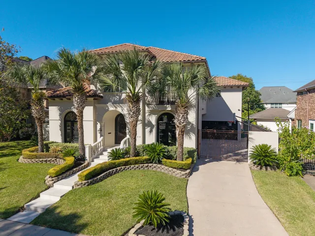 an aerial view of house with yard swimming pool and outdoor seating