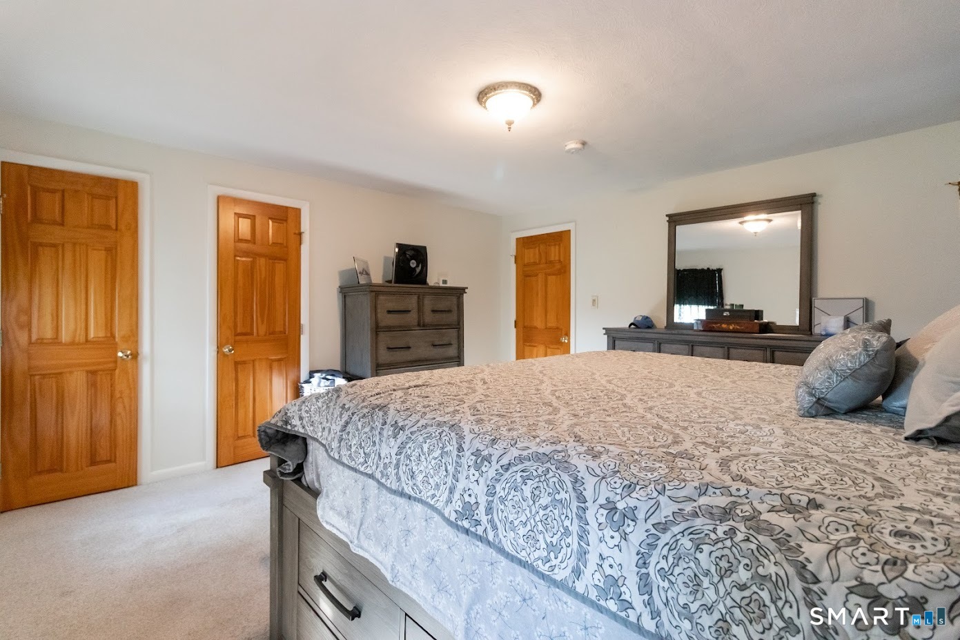 763 North Street Suffield, CT 06078 - Photo 25 of 40 a bedroom with a large bed and dresser