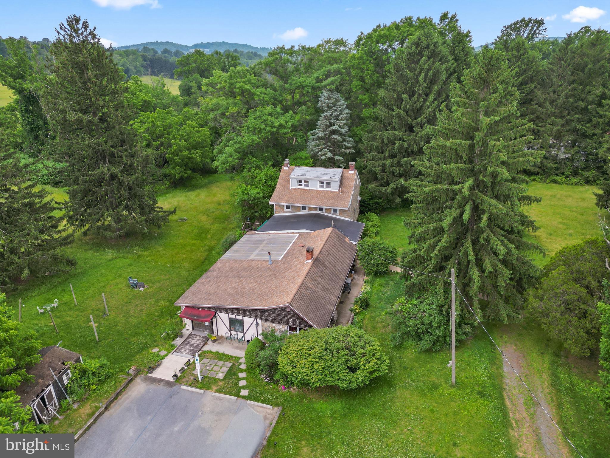 564 Blandon Road Fleetwood, PA 19522 - Photo 5 of 45 an aerial view of a house with pool a yard and a large tree
