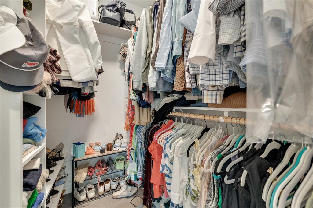 6004 Hudson Street, Unit 102 Dallas, TX 75206 - Photo 14 of 22 a view of walk in closet with clothes and shoes