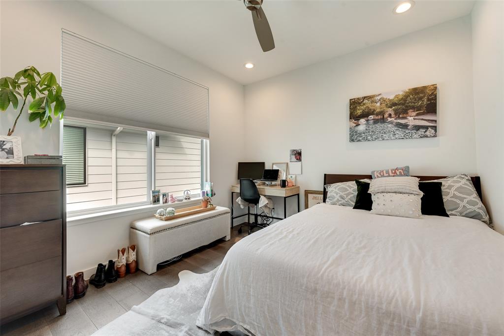 6004 Hudson Street, Unit 102 Dallas, TX 75206 - Photo 16 of 22 a spacious bedroom with two beds and a potted plant