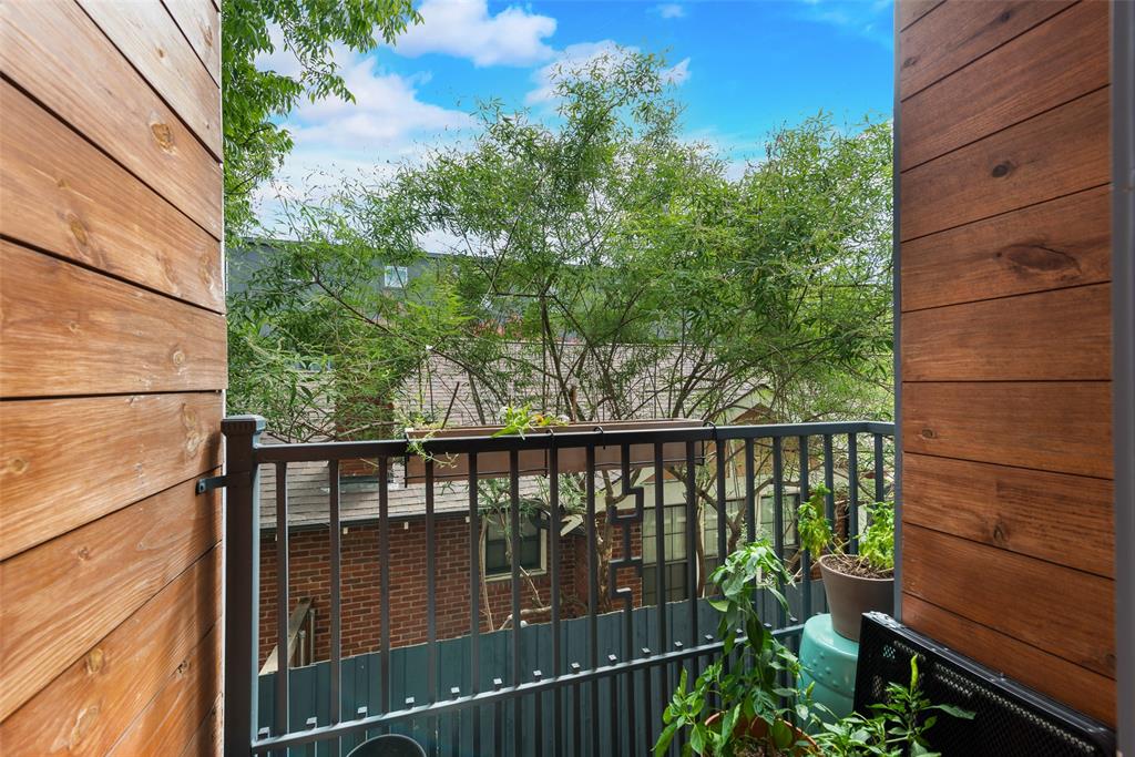 6004 Hudson Street, Unit 102 Dallas, TX 75206 - Photo 19 of 22 a view of a balcony with wooden floor