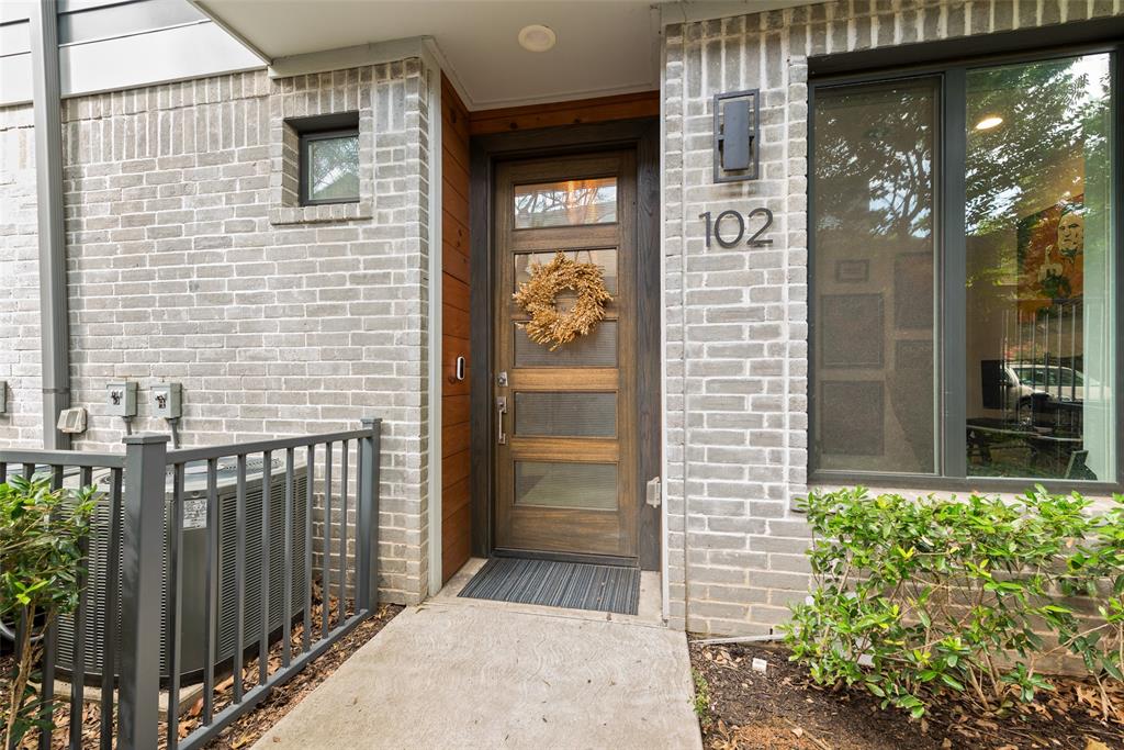 6004 Hudson Street, Unit 102 Dallas, TX 75206 - Photo 2 of 22 a view of a wooden door