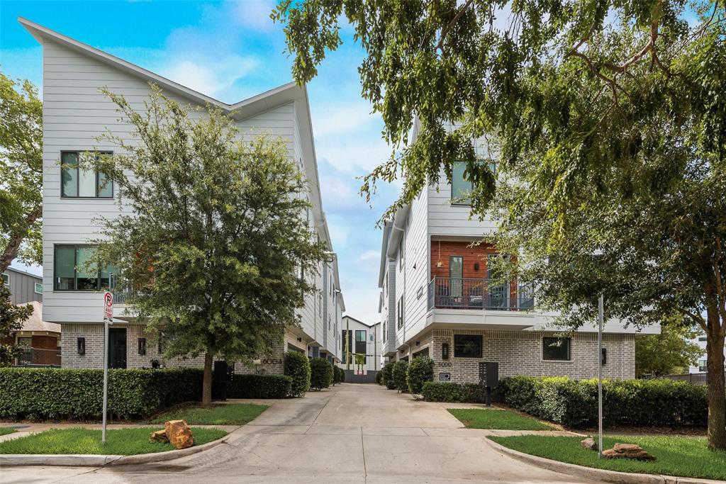 6004 Hudson Street, Unit 102 Dallas, TX 75206 - Photo 20 of 22 a front view of a house with a tree