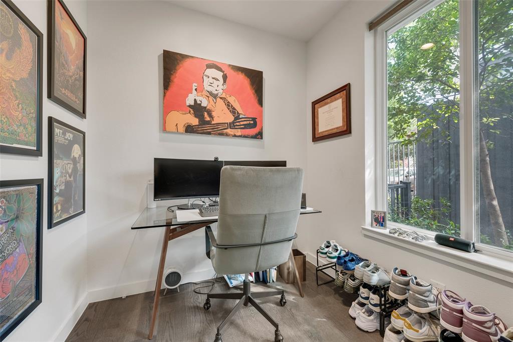 6004 Hudson Street, Unit 102 Dallas, TX 75206 - Photo 4 of 22 a view of a workspace with furniture and a window