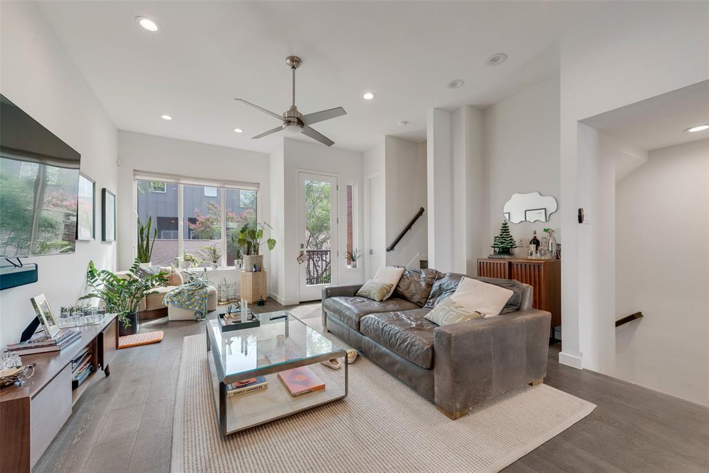 6004 Hudson Street, Unit 102 Dallas, TX 75206 - Photo 7 of 22 a living room with furniture and a chandelier