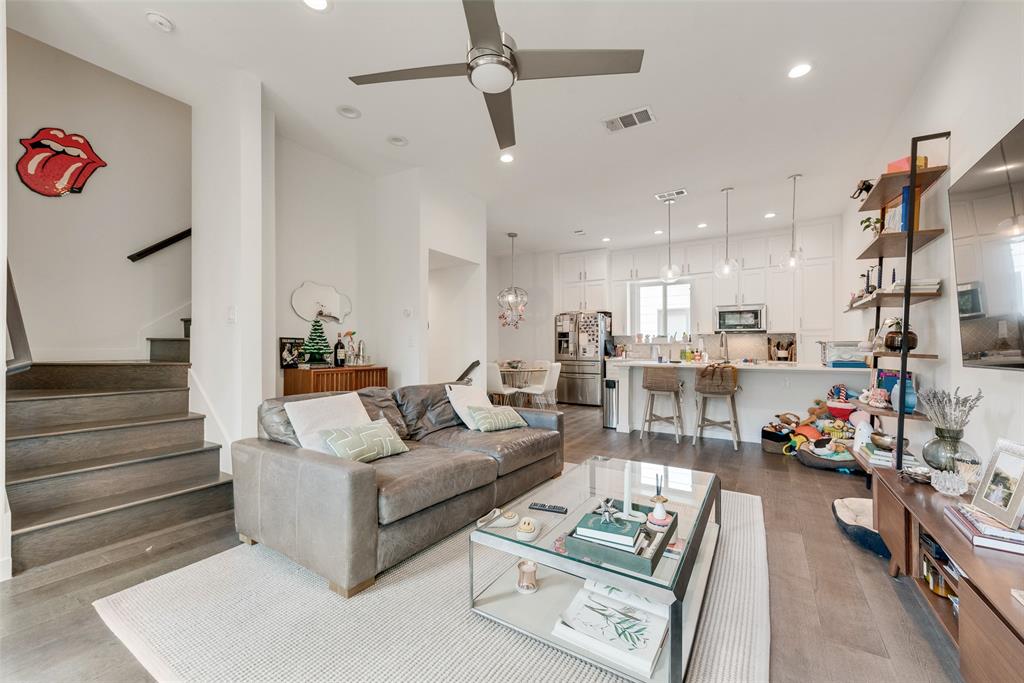 6004 Hudson Street, Unit 102 Dallas, TX 75206 - Photo 8 of 22 a living room with furniture kitchen view and a chandelier