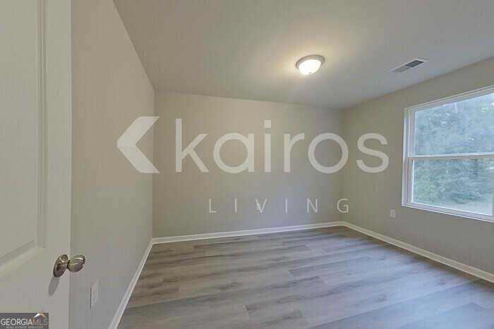236 Sunrise Circle Midway, GA 31320 - Photo 15 of 31 a view of a room with wooden floor and window